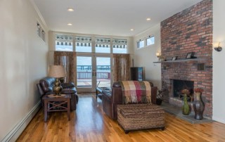 living room with brick fireplace