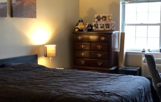 master bedroom with bed and dresser